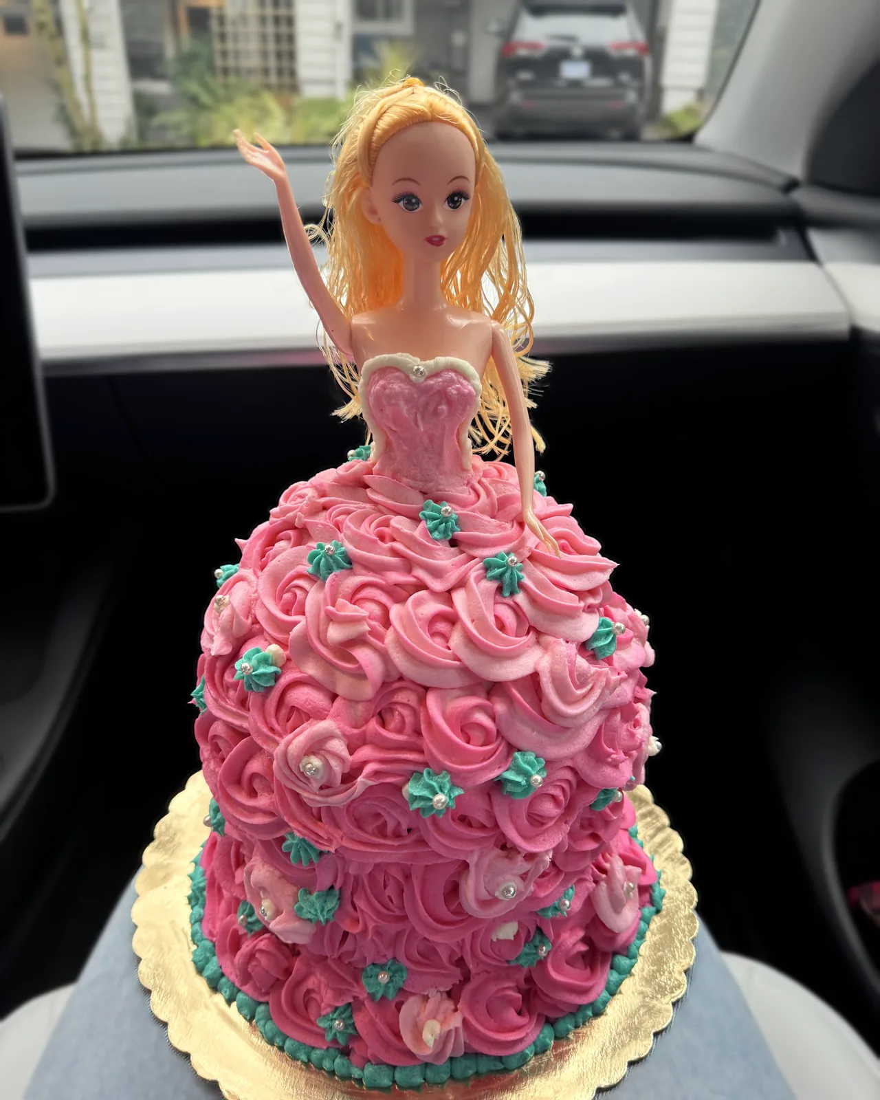 Doll dress cake with pink rosette frosting