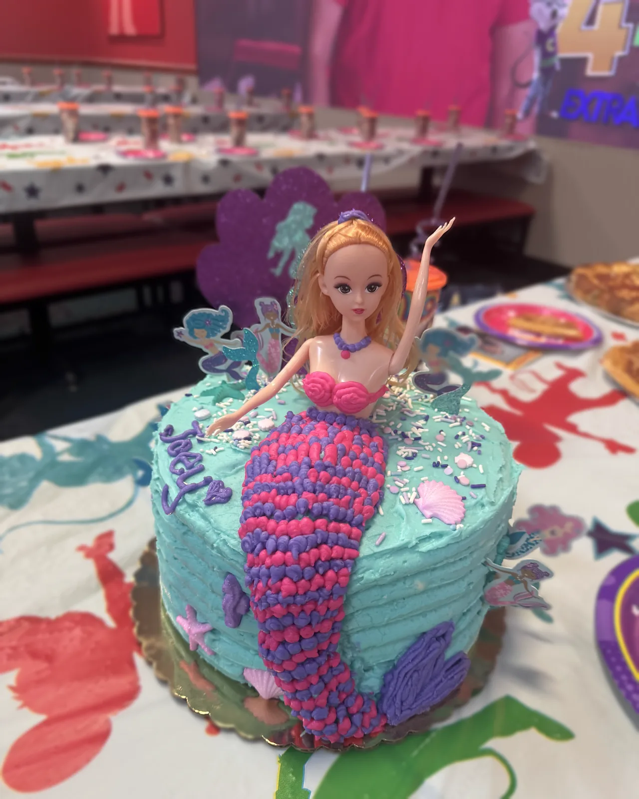 Mermaid themed cake with doll topper